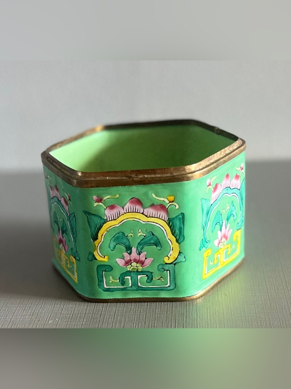 Chinese green hand-painted enamel box vibrant pink floral motif & a metal rim